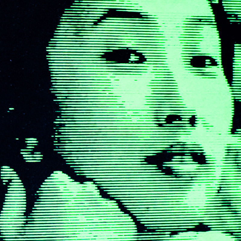 Green computer like image of a woman's face